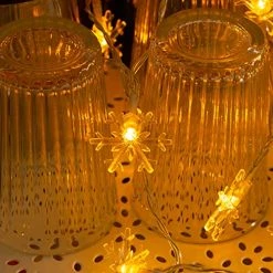 FUNPENY 100 LED Christmas Snowflake String Lights, 49 FT Waterproof Connectable Fairy Light Plug In With 8 Modes For Indoor Outdoor Wedding Xmas Tree Party Garden Decorations, Warm White -Funpeny Shop 51 Wk7FEw9L