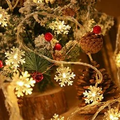 FUNPENY 100 LED Christmas Snowflake String Lights, 49 FT Waterproof Connectable Fairy Light Plug In With 8 Modes For Indoor Outdoor Wedding Xmas Tree Party Garden Decorations, Warm White -Funpeny Shop 61SzqqNpZ L